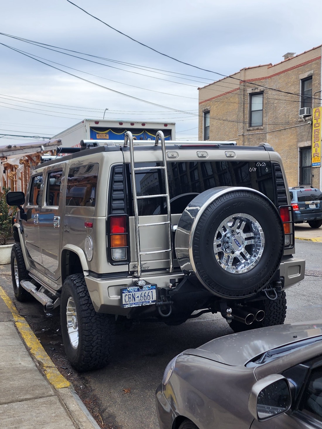 A customer's Hummer H2 parked outside the shop