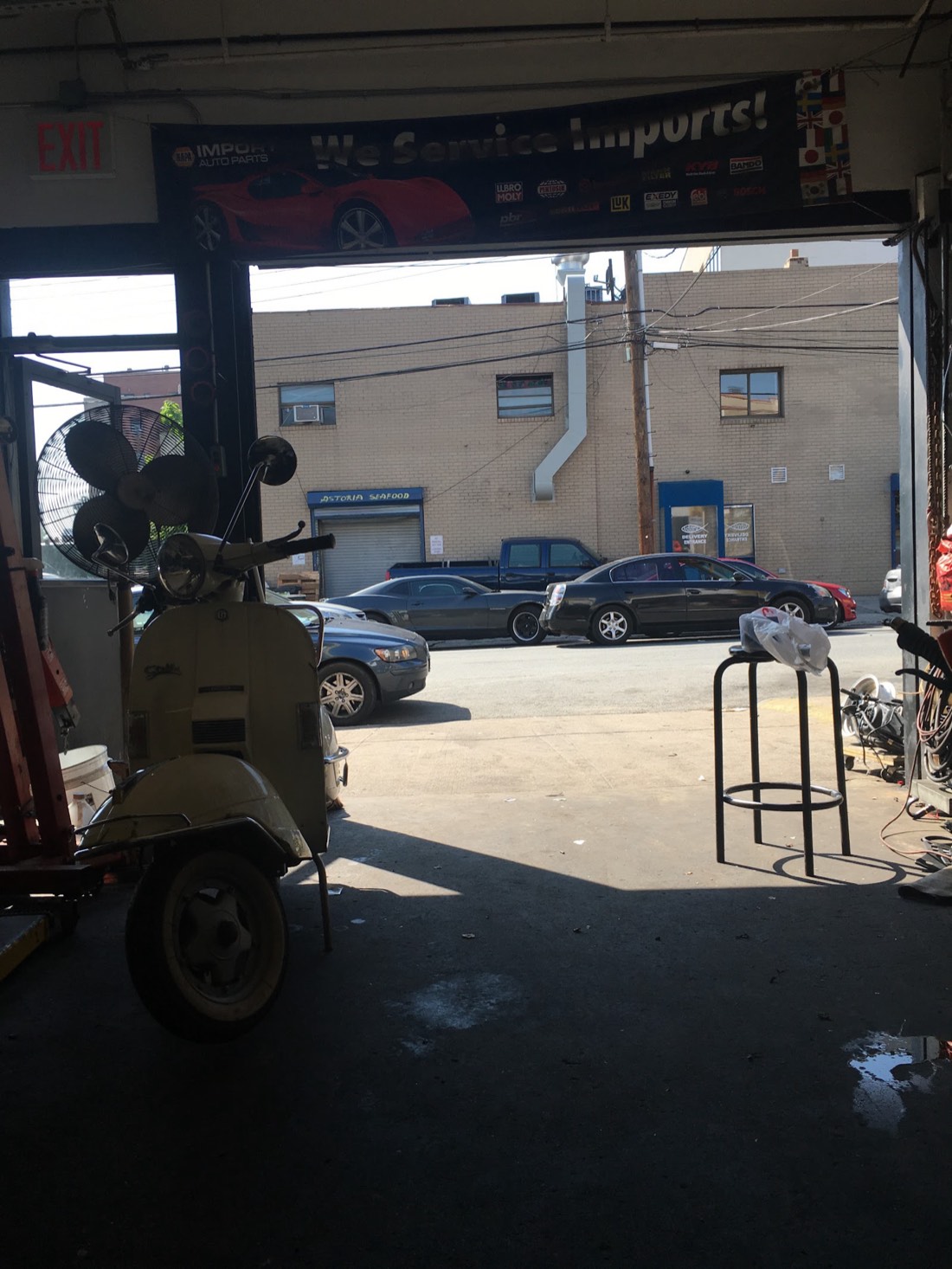 Inside the garage at Mig's 5s Auto Tech, looking out the open bay door
